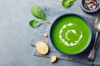 Spinach Soup with Cream in a Bowl. Top View. Copy Space.